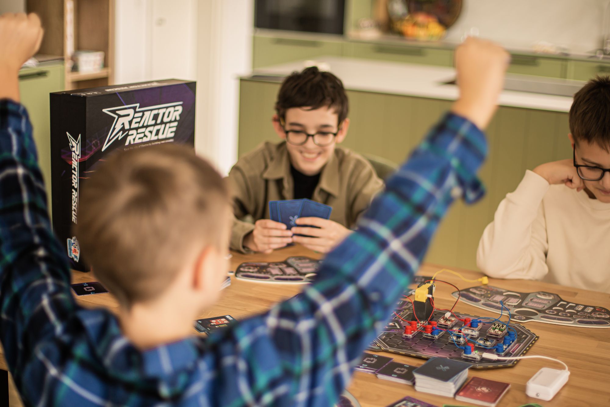 Kids cheering while playing Reactor Rescue